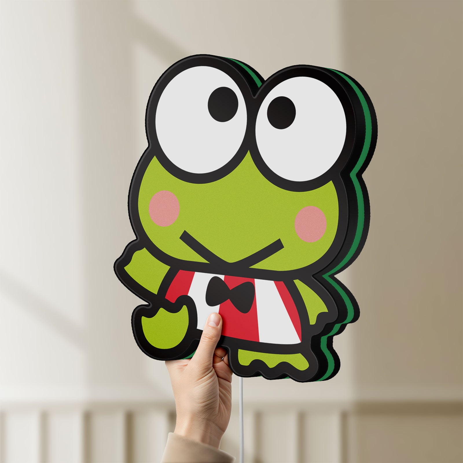 Unlit Keroppi LED lightbox held by hand to show size and details