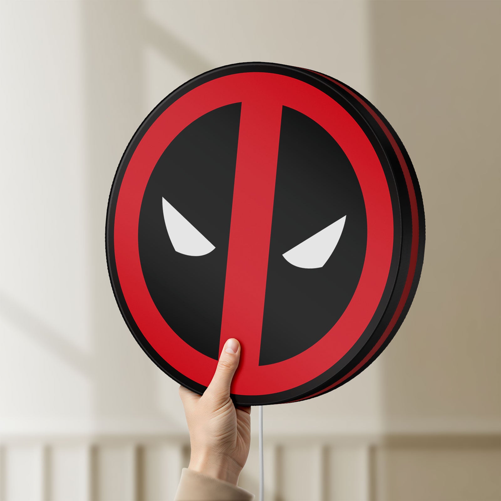 Unlit Deadpool LED lightbox held by hand to show size and details