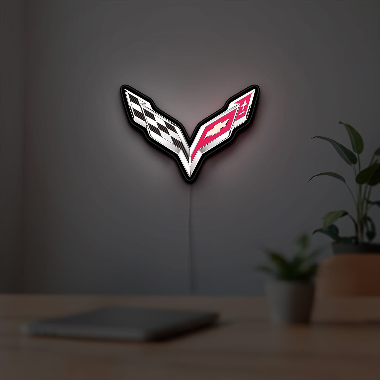 Corvette LED lightbox hanging on a room wall with soft white light