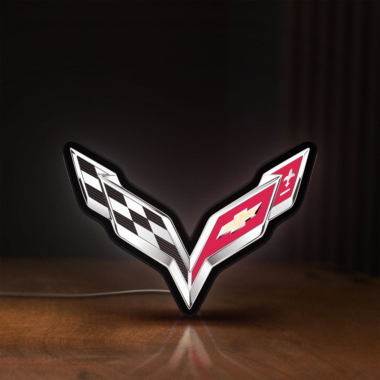 Front view of Corvette LED lightbox sign glowing on a wooden desk