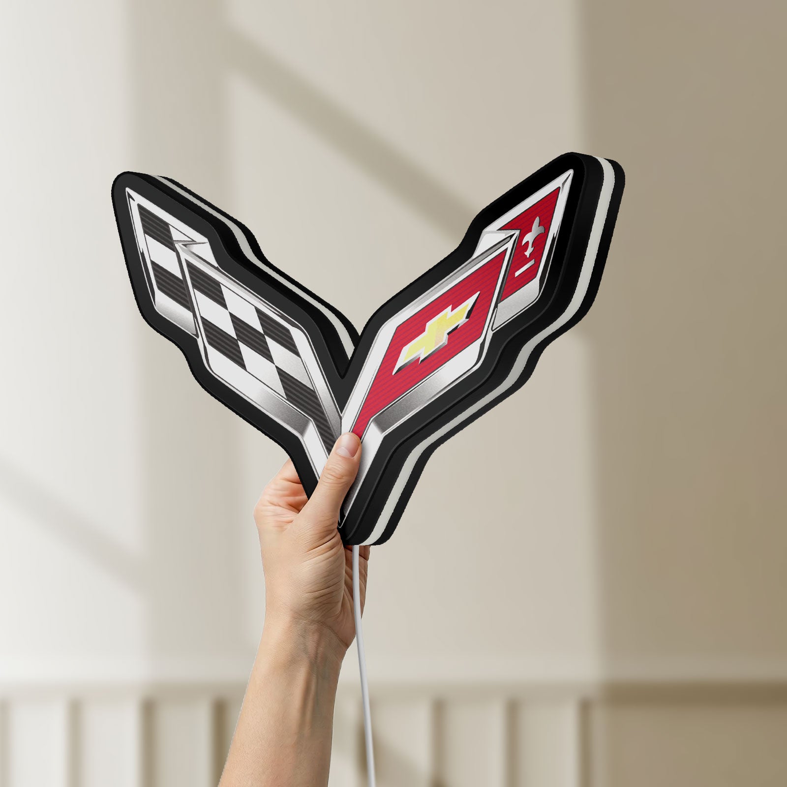 Unlit Corvette LED lightbox held by hand to show size and details