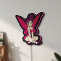 Unlit Tinkerbell LED lightbox mounted on a wall in daylight