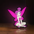 Front view of Tinkerbell LED lightbox sign glowing on a wooden desk