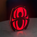 Spider-Man LED lightbox standing on a desk from an angled side view with red glow