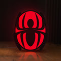 Front view of Spider-Man LED lightbox sign glowing on a wooden desk