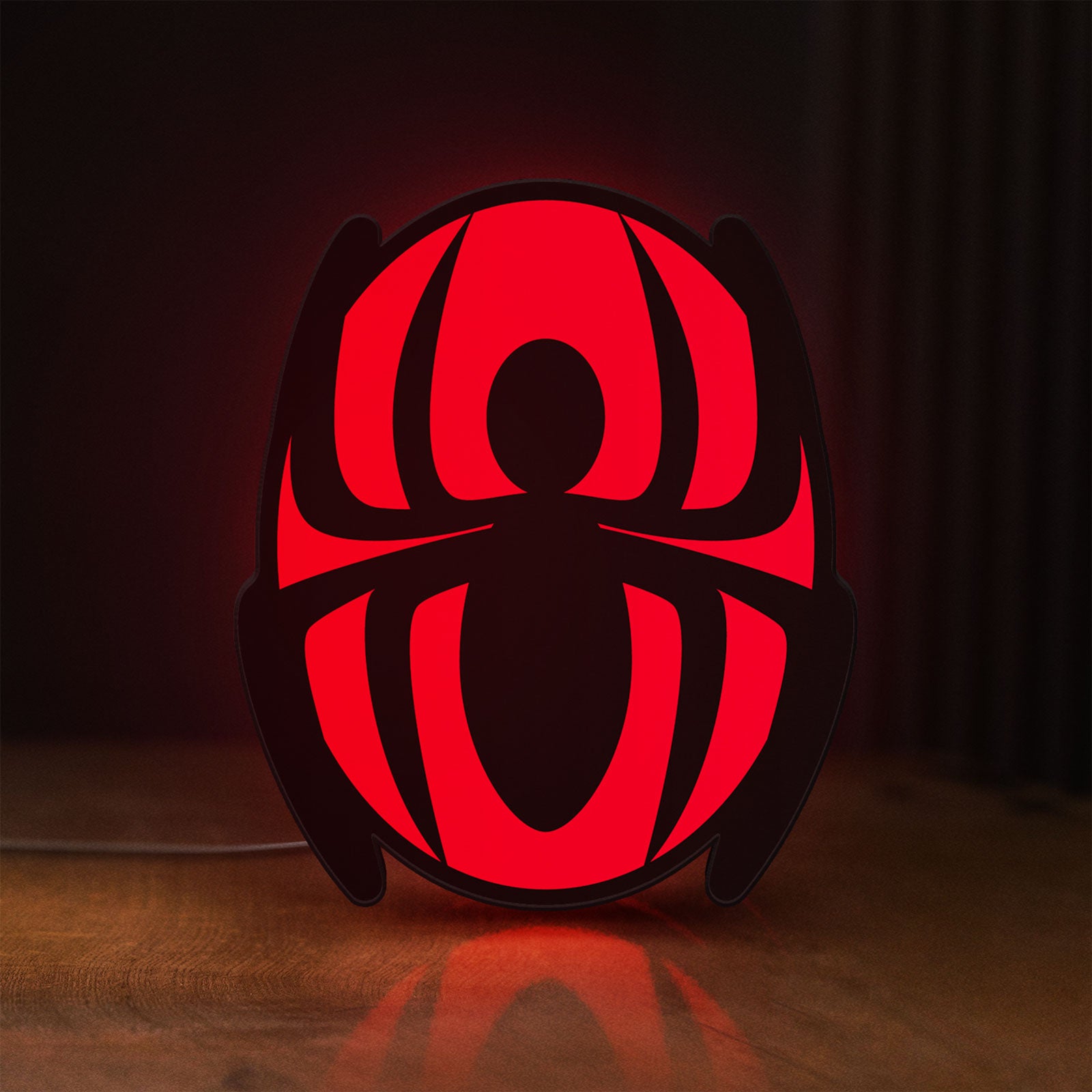 Front view of Spider-Man LED lightbox sign glowing on a wooden desk