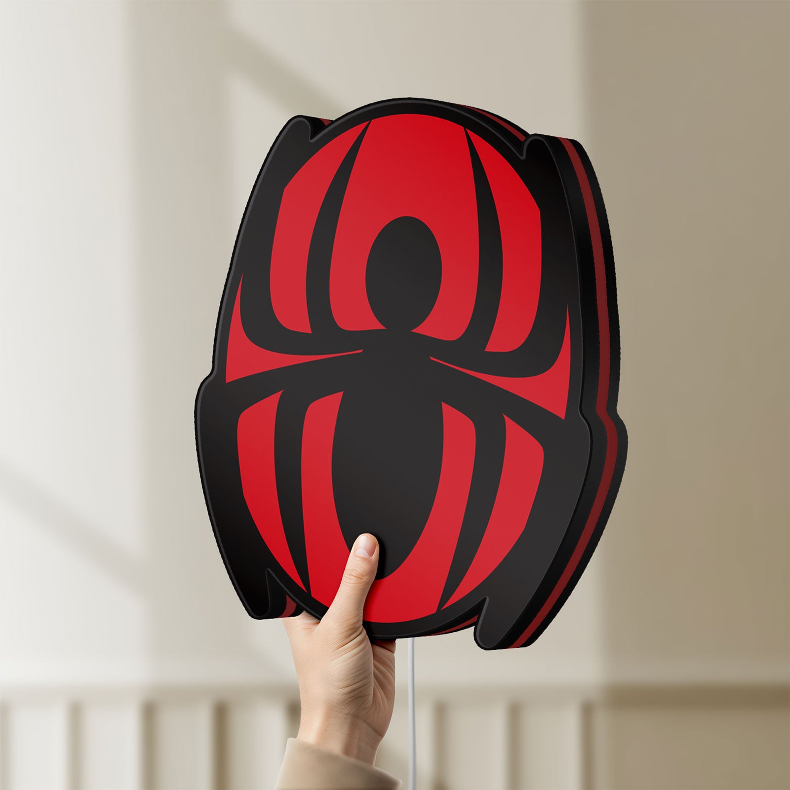 Unlit Spider-Man LED lightbox held by hand to show size and details