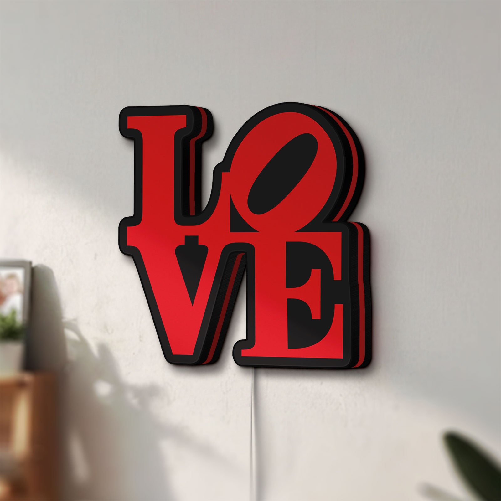 Unlit Love LED lightbox mounted on a wall in daylight