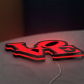 Love LED lightbox lying flat on a desk with red glow