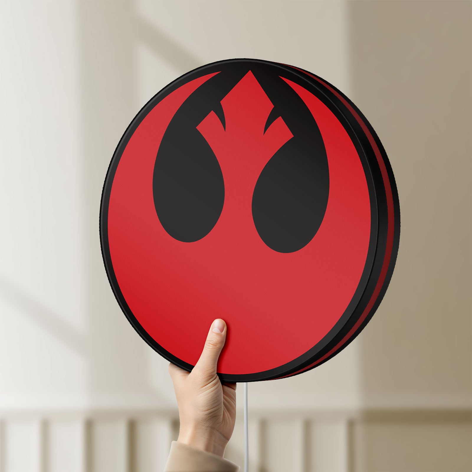 Unlit Rebel Alliance LED lightbox held by hand to show size and details