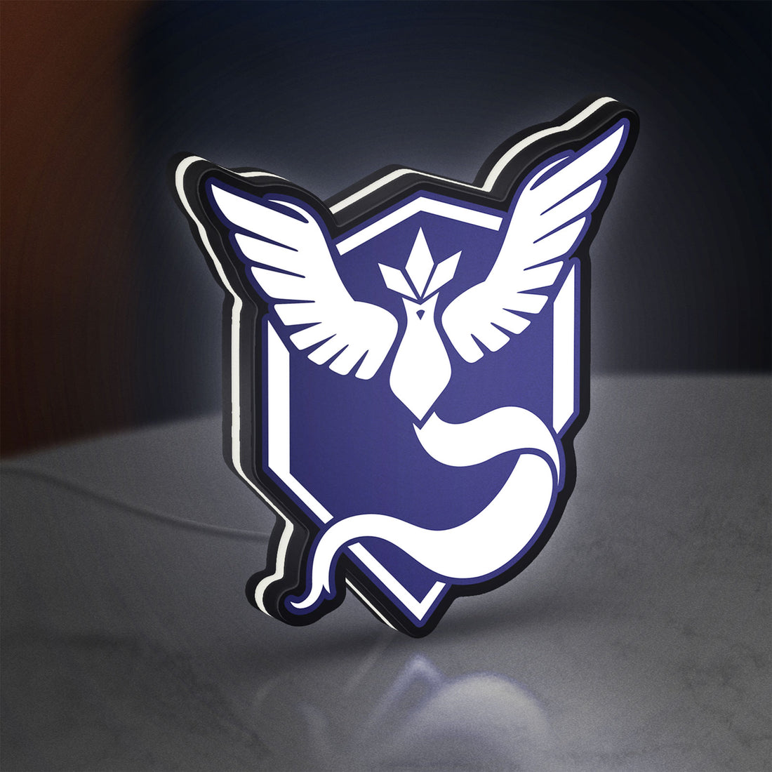 Pokemon GO Team Mystic LED lightbox hanging on a wall with white glow
