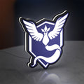 Pokemon GO Team Mystic LED lightbox standing on a desk from an angled side view with white glow