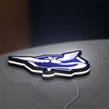 Pokemon GO Team Mystic LED lightbox lying flat on a desk with white glow