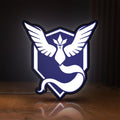Front view of Pokemon GO Team Mystic LED lightbox sign glowing on a wooden desk
