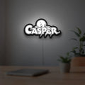 Casper LED lightbox hanging on a room wall with soft white light