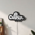 Unlit Casper LED lightbox mounted on a wall in daylight