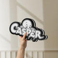 Unlit Casper LED lightbox held by hand to show size and details