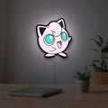 Jigglypuff LED lightbox hanging on a room wall with soft white light