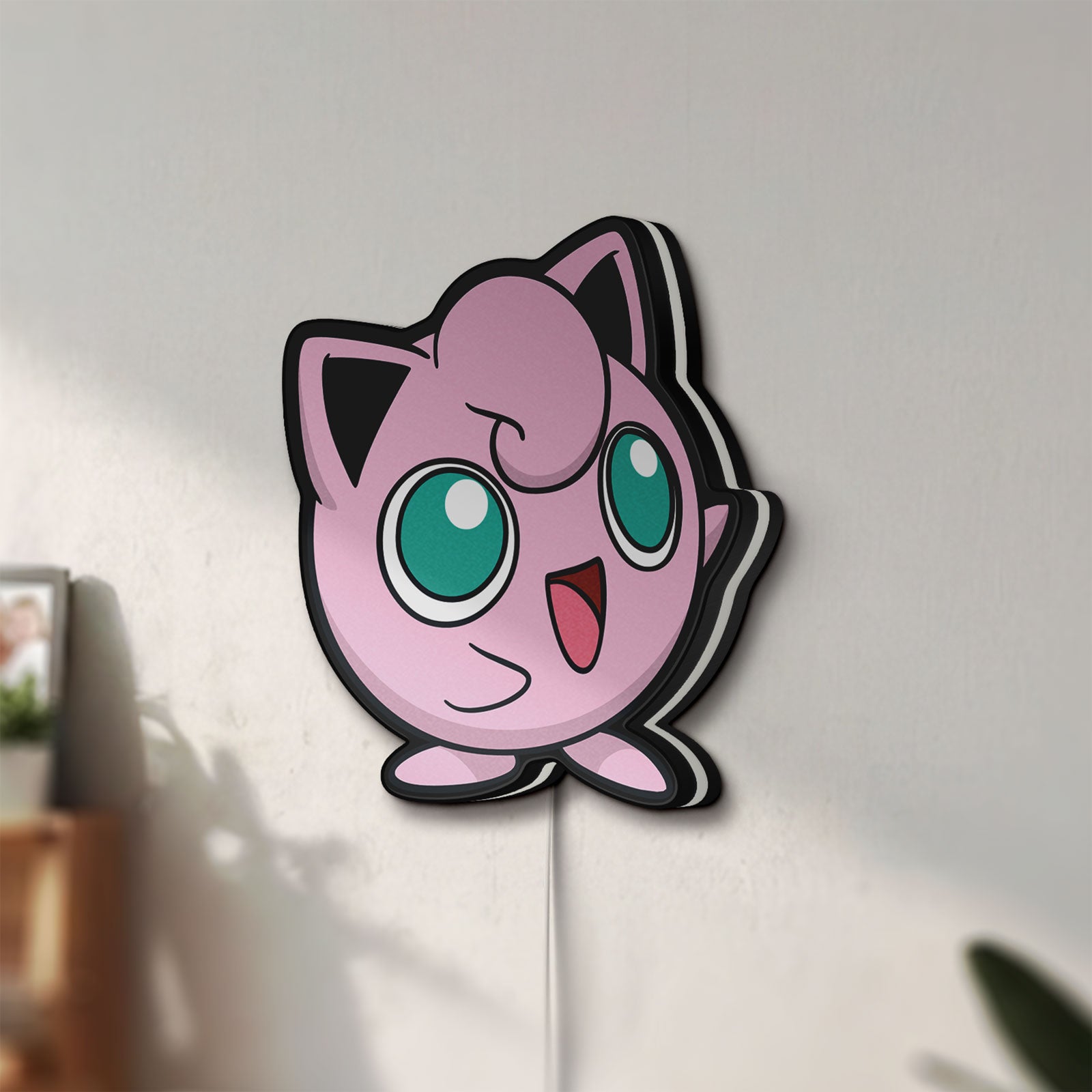 Unlit Jigglypuff LED lightbox mounted on a wall in daylight