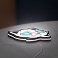 Jigglypuff LED lightbox lying flat on a desk with white glow