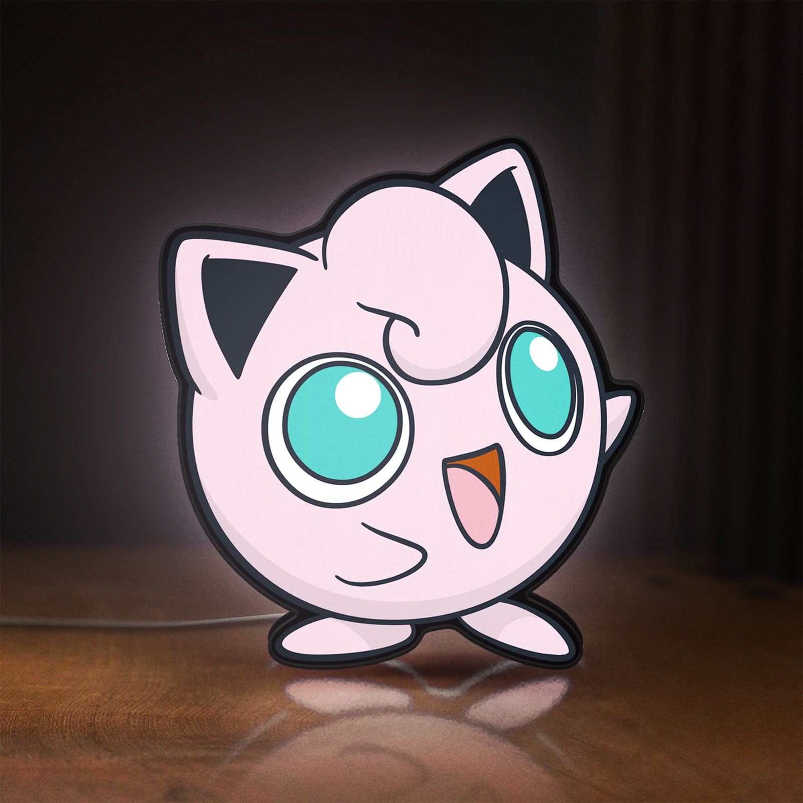 Front view of Jigglypuff LED lightbox sign glowing on a wooden desk