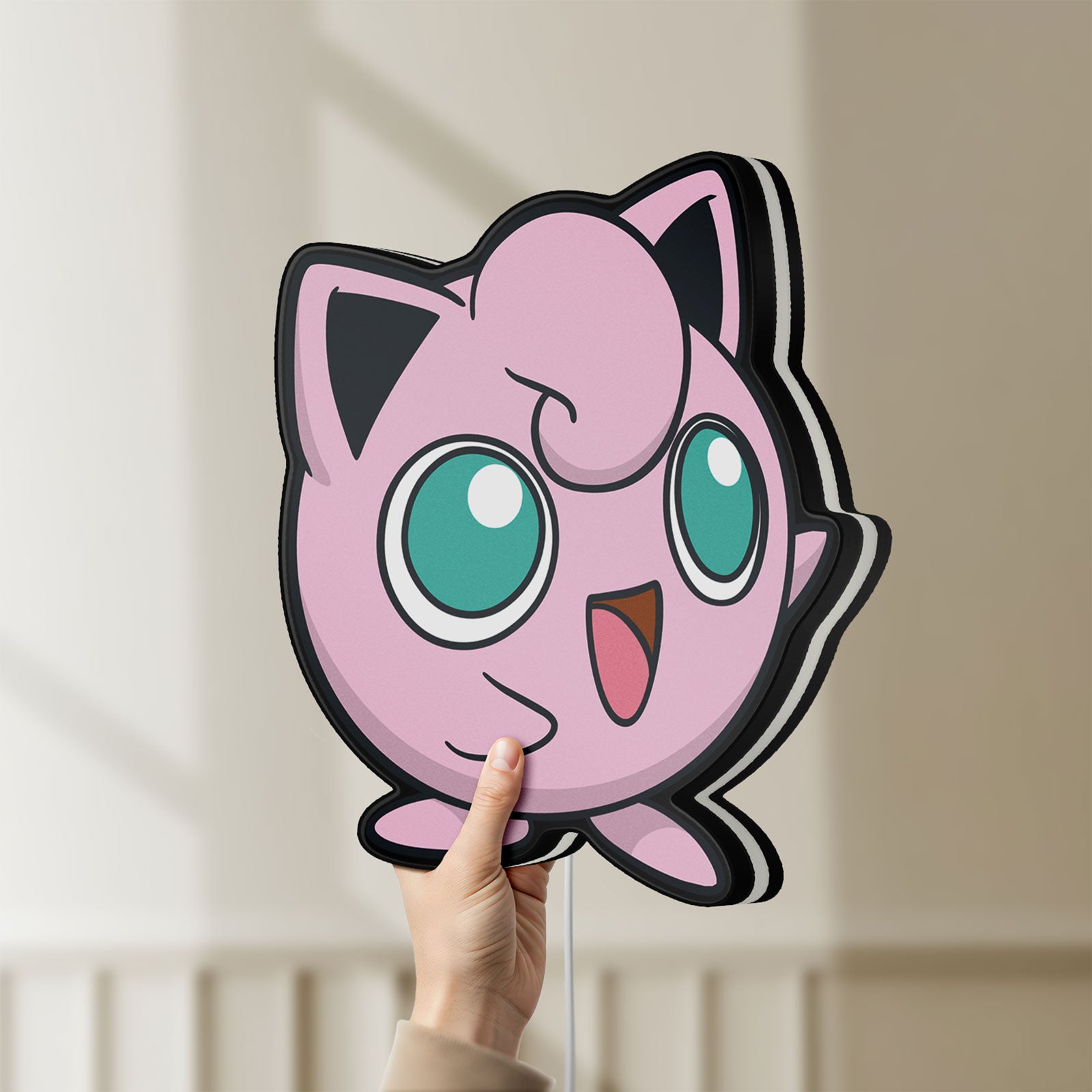Unlit Jigglypuff LED lightbox held by hand to show size and details
