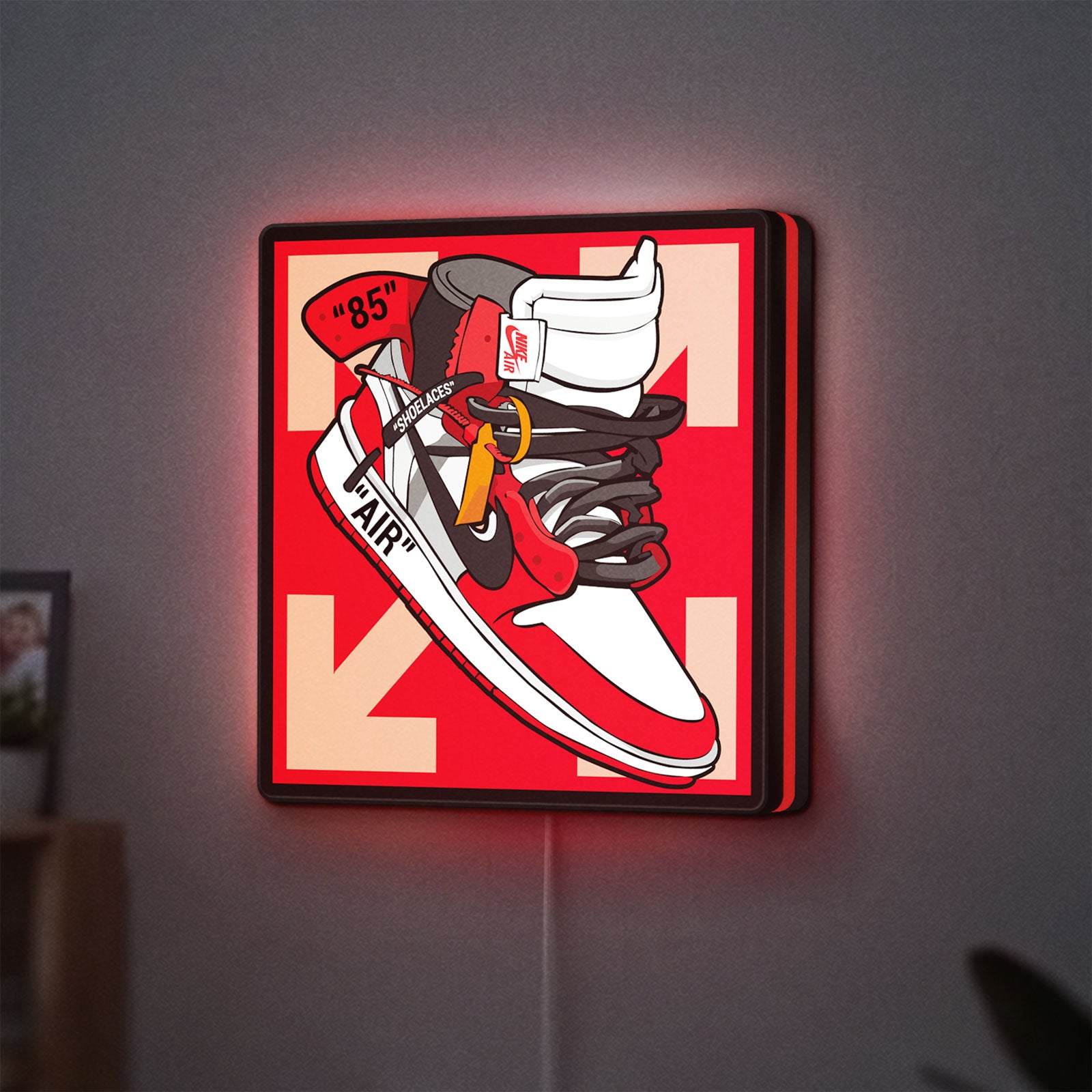 Nike Jordan Air Shoe LED lightbox hanging on a wall with red glow