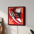 Unlit Nike Jordan Air Shoe LED lightbox mounted on a wall in daylight