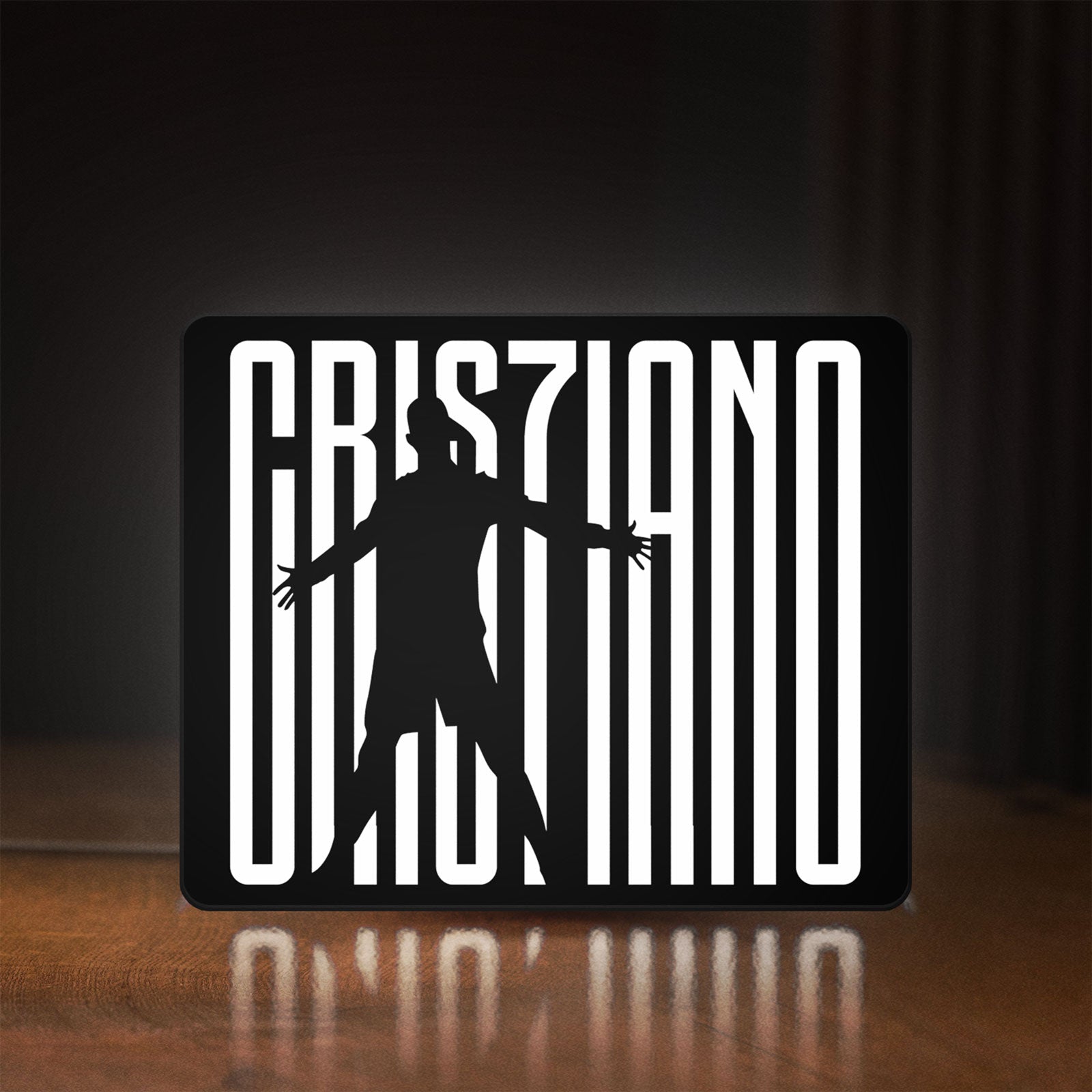 Front view of CR 7 Juventus LED lightbox sign glowing on a wooden desk