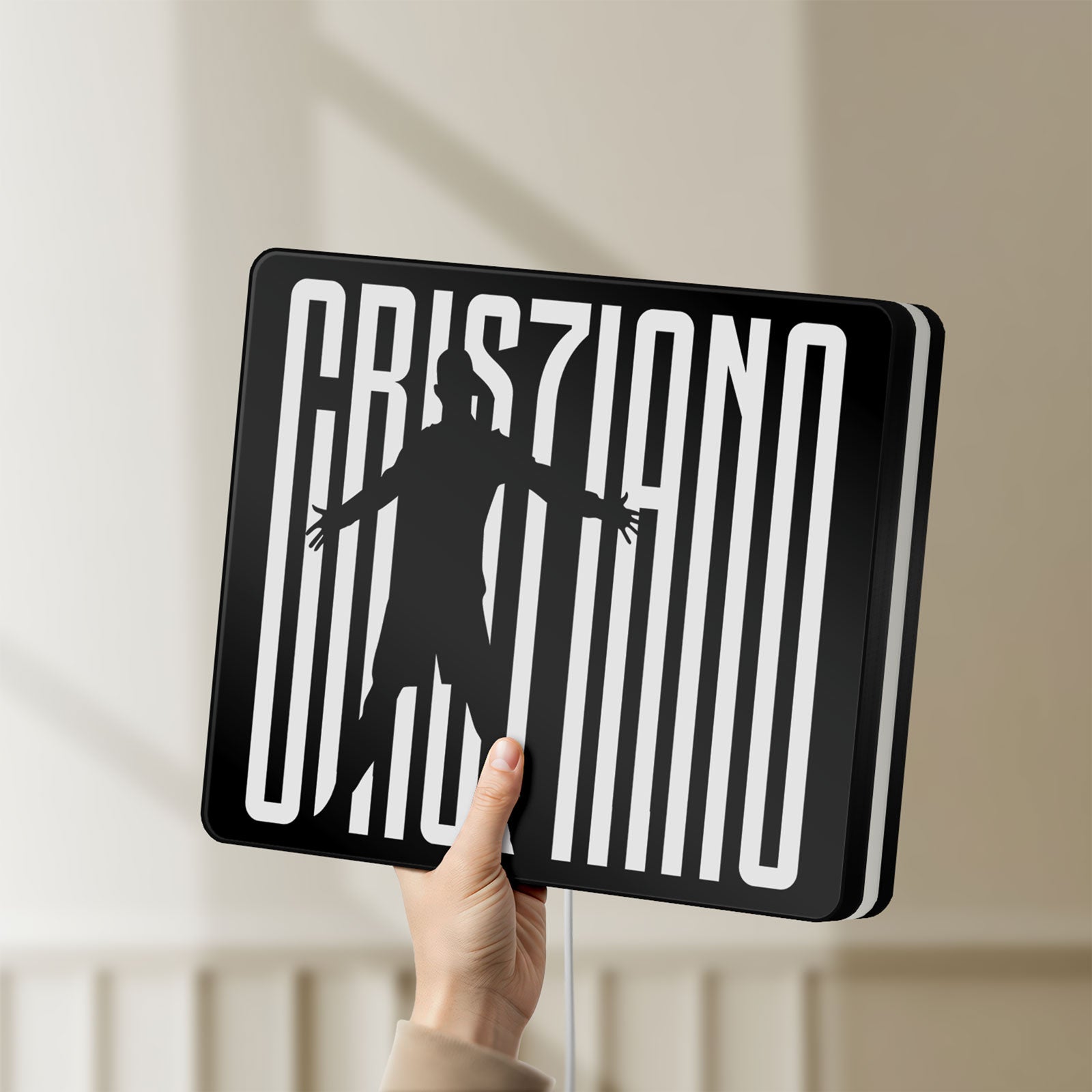 Unlit CR 7 Juventus LED lightbox held by hand to show size and details