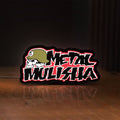 Front view of Metal Mulisha LED lightbox sign glowing on a wooden desk
