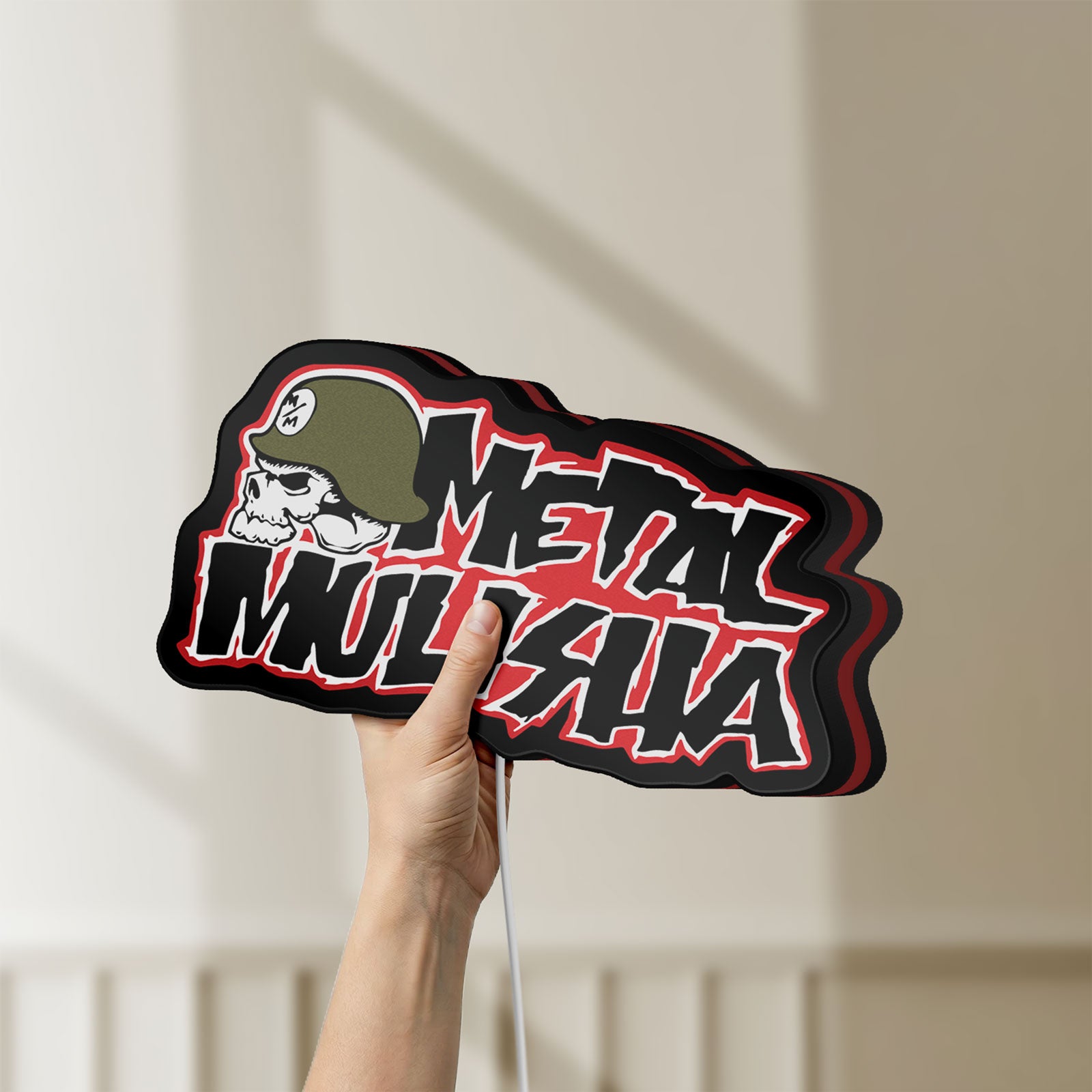 Unlit Metal Mulisha LED lightbox held by hand to show size and details