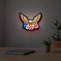 Eagle LED lightbox hanging on a room wall with soft white light