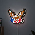 Eagle LED lightbox hanging on a wall with white glow