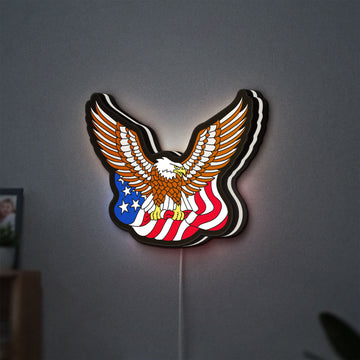 Eagle LED lightbox hanging on a wall with white glow