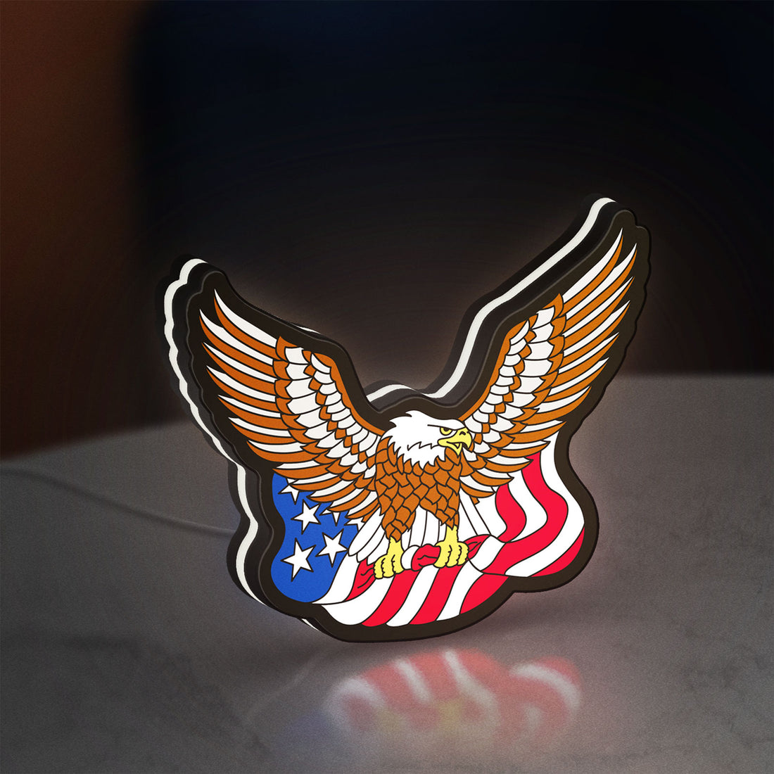 Eagle LED lightbox hanging on a wall with white glow