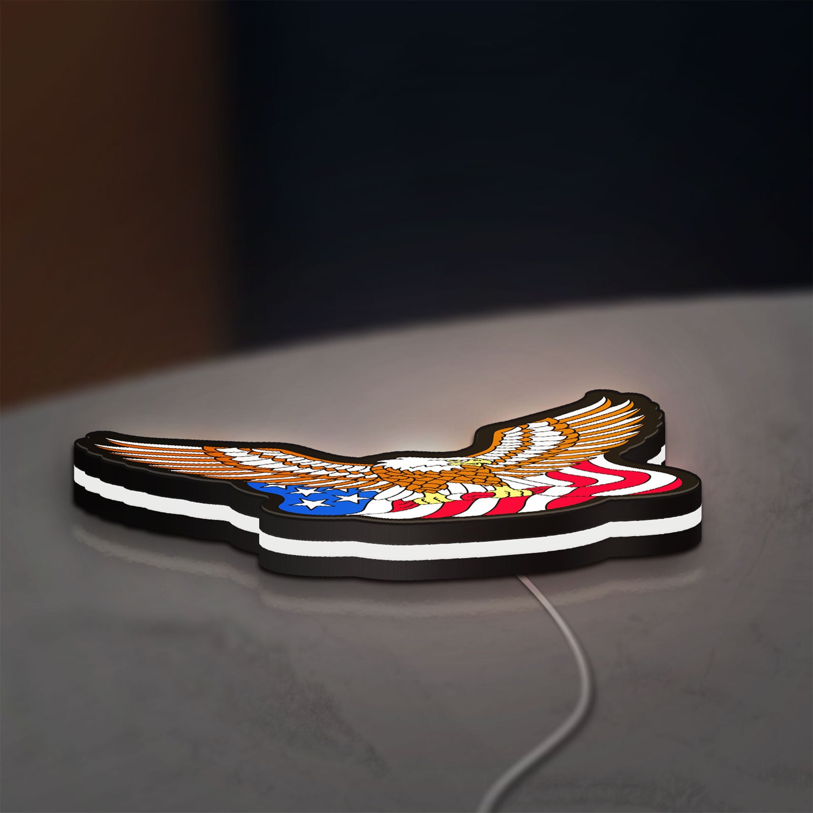 Eagle LED lightbox lying flat on a desk with white glow
