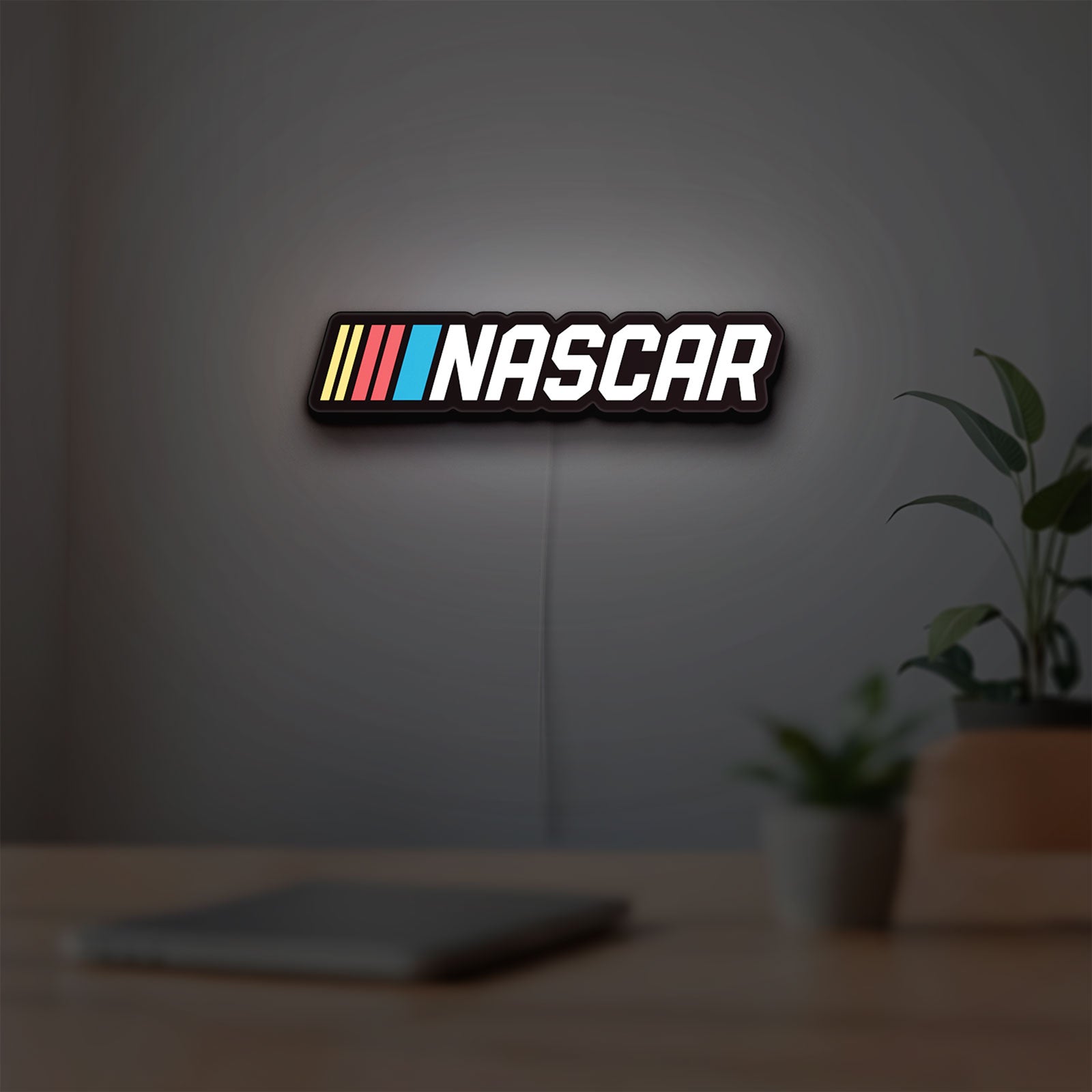 NASCAR LED lightbox hanging on a room wall with soft white light