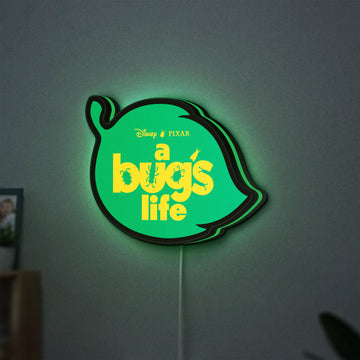 A Bug's Life LED lightbox hanging on a wall with green glow