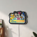 Unlit Disney Babies LED lightbox mounted on a wall in daylight