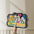 Unlit Disney Babies LED lightbox held by hand to show size and details