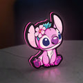 Pink Stitch LED lightbox standing on a desk from an angled side view with pink glow