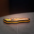 Lightning McQueen LED lightbox lying flat on a desk with orange glow