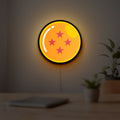 4 Star Dragon Ball LED lightbox hanging on a room wall with soft yellow light