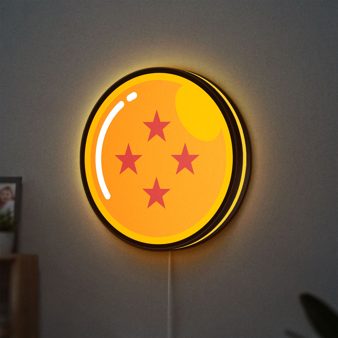 4 Star Dragon Ball LED lightbox hanging on a wall with yellow glow