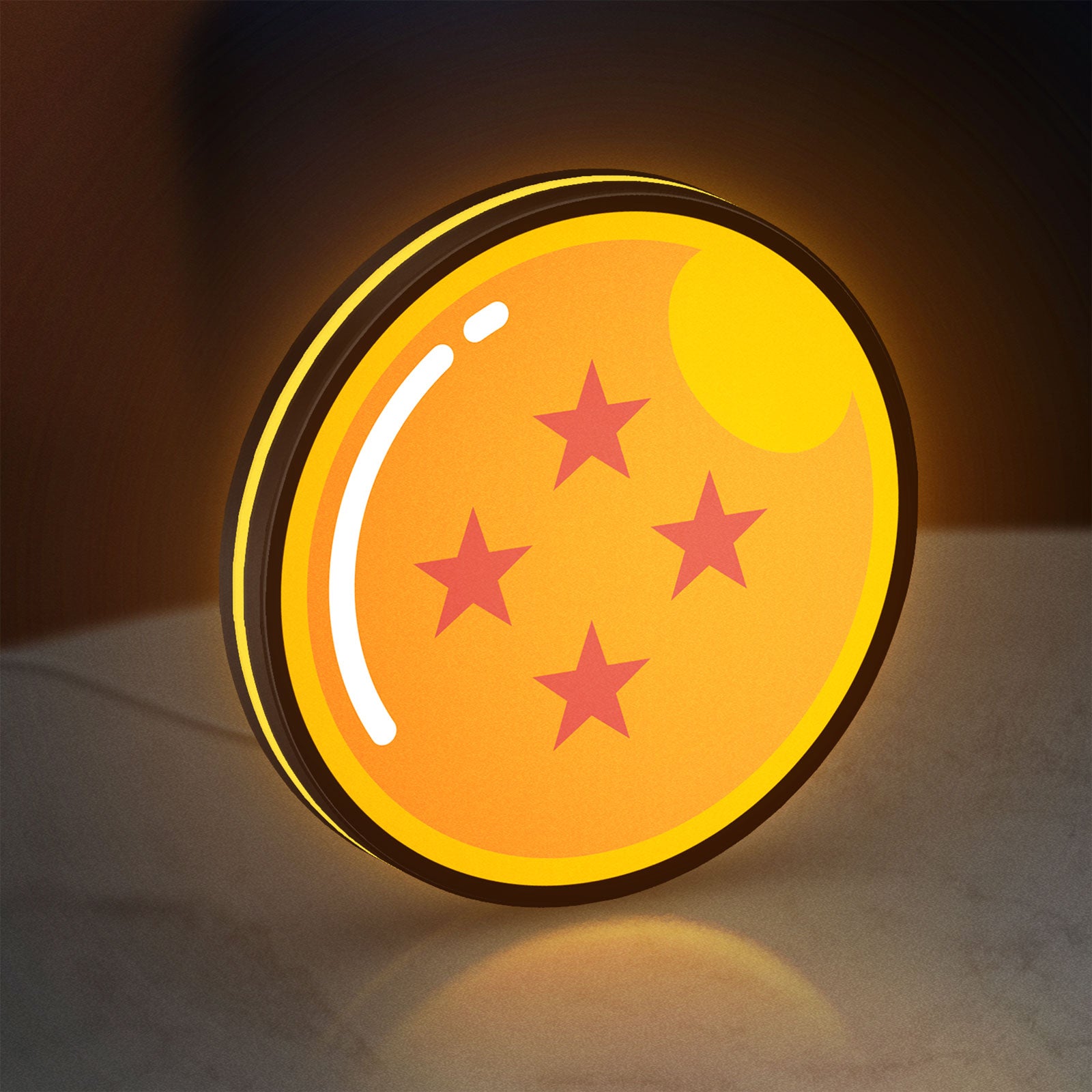 4 Star Dragon Ball LED lightbox standing on a desk from an angled side view with yellow glow