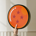 Unlit 4 Star Dragon Ball LED lightbox held by hand to show size and details