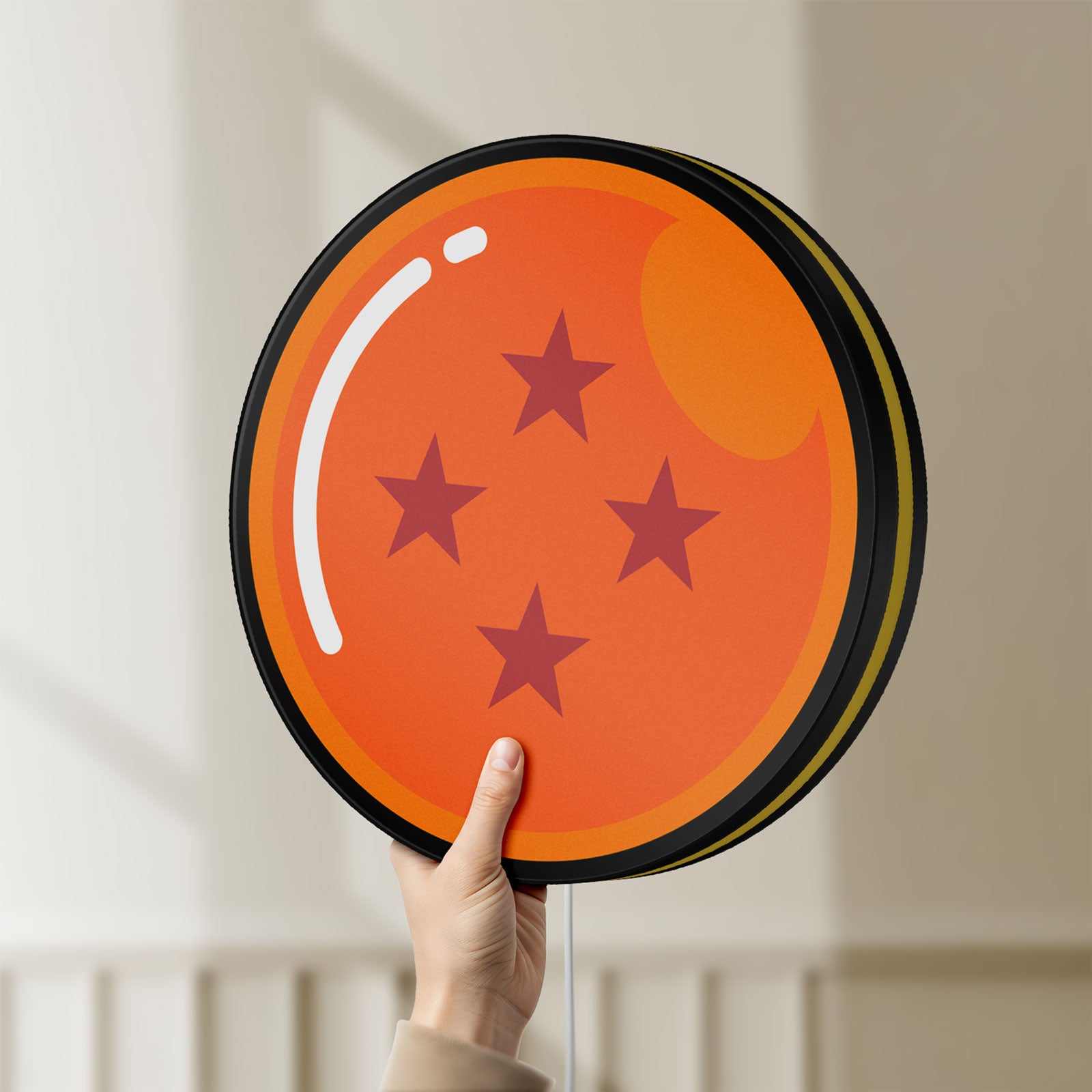 Unlit 4 Star Dragon Ball LED lightbox held by hand to show size and details