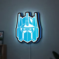 Optimus Prime LED lightbox hanging on a wall with blue glow