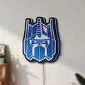 Unlit Optimus Prime LED lightbox mounted on a wall in daylight